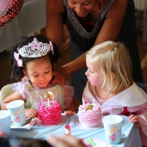 Celebration iced cupcakes with candles